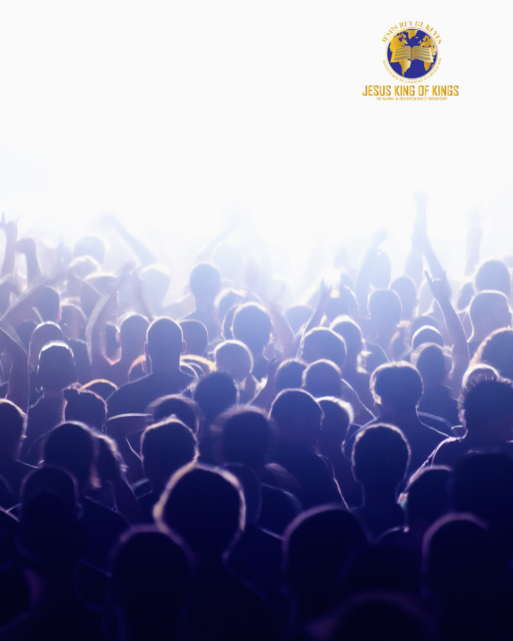 A congregation worshiping with hands raised under bright light at a Jesus King of Kings service.